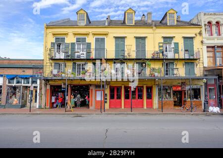 Typical architecture, old houses, retail, commercial, store buildings on Decatur Street, New Orleans French Quarter New Orleans, Louisiana, USA Stock Photo