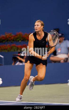 Flushing Meadows, New York, United States - September 9, 2006. Maria Sharapova in action during the 2006 US Opne women's final against Belgian Justine Henin.  Sharapova won in straight sets to capture her first and only US Open Women's title. Sharapova won a total of five grand slam titles during her career and was on of the highest earning female athletes. Stock Photo
