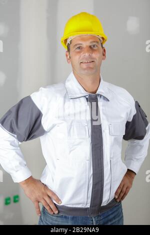 optimistic worker builder man posing looking camera Stock Photo