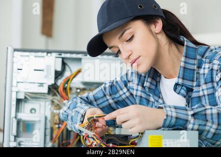 a female computer hardware assembler Stock Photo