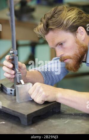 concentrated man measuring panel with metal liner Stock Photo