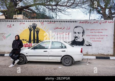 Mural of Abu Jihad on a wall at the Aida refugee camp in Bethlehem, Palestine. Stock Photo