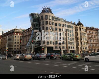 Famous dancing house building architecture in prague with car traffic transport Stock Photo