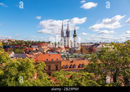 Panoramic view of historic Zagreb upper city with rooftops and cathedral towers on beautiful sunny day. Image Stock Photo