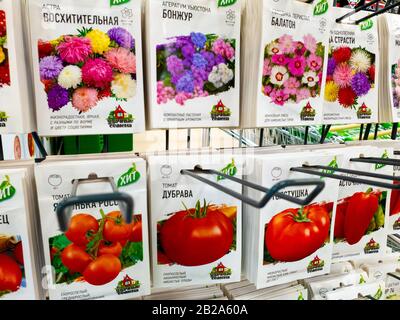 Moscow, Russia - Feb 15. 2020. Seeds of tomatoes and flowers in paper bags are sold in the store Stock Photo
