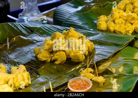 Small cooked dumplings at a street food stall, Bangkok, Thailand Stock Photo