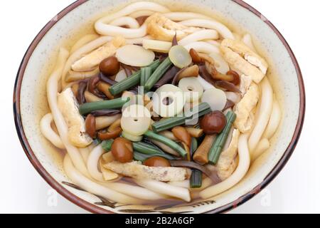 Japanese Sansai udon noodles in a ceramic bowl Stock Photo