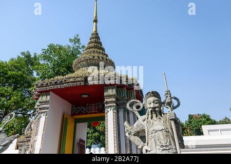 Statue of an ancient Chinese warrior at the entrance to Wat Pho, Bangkok, Thailand Stock Photo