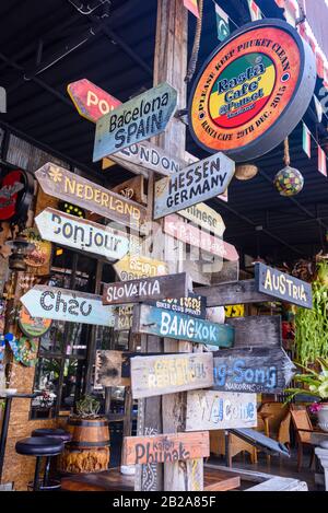 Wooden direction and distance signs for various world destinations including Slovakia, Bangkok, Barcelona, Hessen, London, Austria, Thailand Stock Photo