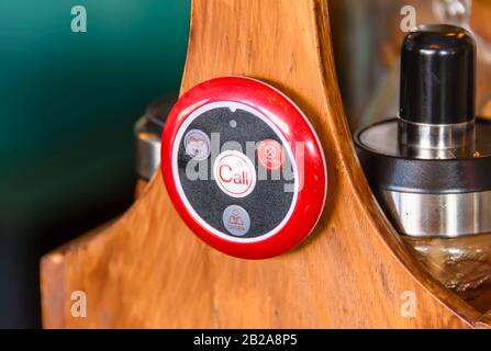Electronic tag on the condiment stand on a table in a restaurant, with buttons to call for service, payment, place an order, or ask for the bill, Pato Stock Photo