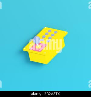 Yellow retro arcade game controller on bright blue background in pastel colors. Minimalism concept. 3d render Stock Photo