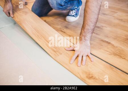 The rules and secrets of laying laminate with lock fastening - technology in pictures Stock Photo