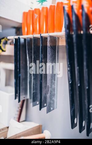 Carpentry workshop - a professional tool in the workplace- saws and hacksaws Stock Photo