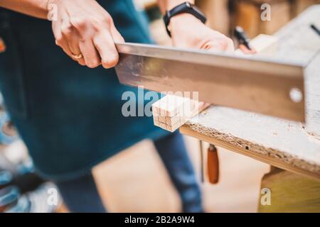 Manual processing of wood in the carpentry workshop - craft production Stock Photo