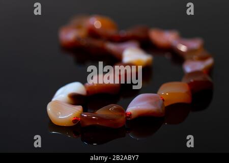 Brown agate beads isolated on black background Stock Photo