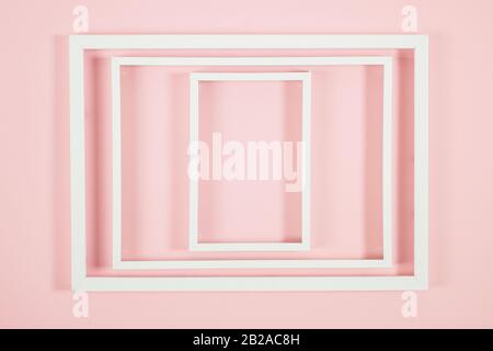 White frames on pink background and some shadows Stock Photo