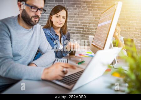 Developing programming and coding technologies. Website design. Programmer working in a software develop company office. Stock Photo
