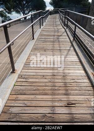 Wood floor of bridge for handicapped visitors of the castle in wheelchairs. Aged wood of moat protection castle., fiber. Stock Photo