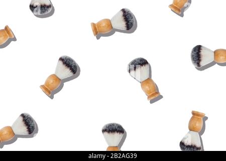 Pattern with shaving brushes on isolated white background. Stock Photo