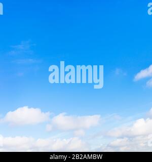 low little clouds in blue sky on sunny winter day Stock Photo