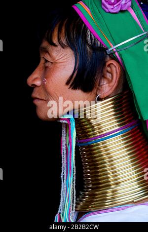 Head portrait of a Kayan Lahwi woman with brass neck coils and traditional clothing. The Long Neck Kayan (also called Padaung in Burmese) are a
