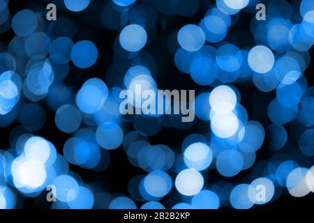 Blurred blue lights with colour adjustment to fit Pantone 19-4052 Classic Blue, colour of the year 2020. Pantone color of the year 2020. Abstract. Stock Photo