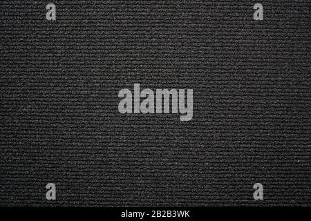 Black background carpeting with small horizontal stripes Stock Photo