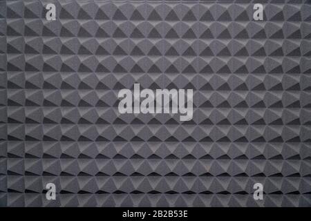 Soundproofing foam rubber texture with convex triangles in studio Stock Photo