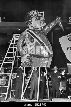 More than 9000 demonstrators gathered in Madison Square Garden in New York City in September 1935 to demonstrate against the possible invasion of Ethiopia by Italy. The picture shows a huge caricature of the fascist Italian dictator Benito Mussolini, whose legs were cut off. Stock Photo