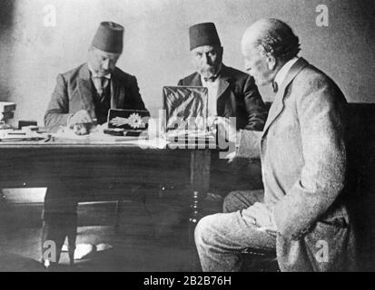 After the deposition of the Ottoman Sultan Abdul Hamid II by young Turkish nationalists, they liquidate his assets. An English expert assesses the value of the jewels. Stock Photo