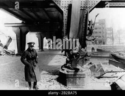 Invasion of Holland 1940: Picture shows bridge of a railroad blown up by the Dutch in Rotterdam and a German officer. Stock Photo