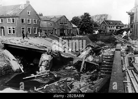 Invasion of Holland 1940: Picture shows a bridge destroyed by the Dutch and houses damaged from the explosion. Stock Photo