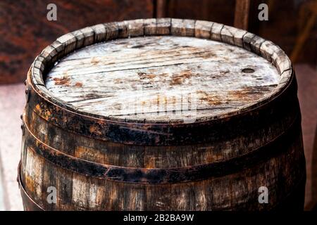 Old rusty barrel 1969 in a cellar room Stock Photo