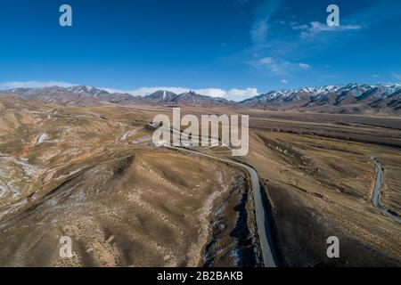 aerial view of the curved Qilian mountain road Stock Photo