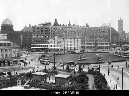 View of the Berlin Alexanderplatz after its redesign. On the left in the background, the building of the police headquarters and on the right in the background the tower of the Berlin City Hall. Stock Photo