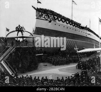The picture shows the launch of the SMF 'Kaiser Wilhelm II'. This is a liner of the Imperial Navy. It belongs to the Kaiser-Friedrich-III class. Prince Heinrich of Prussia christens the ship. Stock Photo