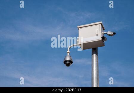 urban security cctv camera on a pole in the city Stock Photo