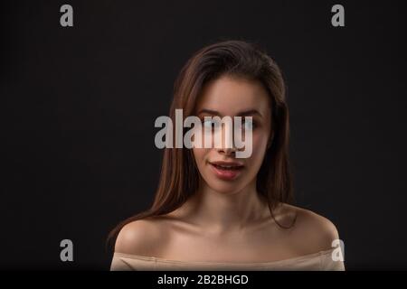 Are you kidding me. Studio shot of playful beautiful european woman, smiling with contempt, mocking or expressing disbelief, hearing funny nonsense Stock Photo