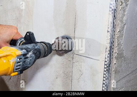 drill hole for electrical outlet outlet, special power tool drill Stock Photo