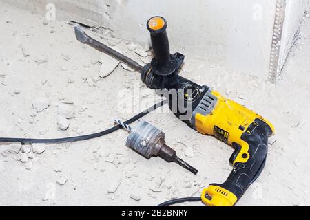 drill hole for electrical outlet outlet, special power tool drill Stock Photo