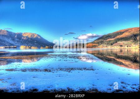 Area of Glencoe, Scotland. Artistic morning view of Loch Leven looking west towards North Ballachulish from the shores of Invercoe. Stock Photo