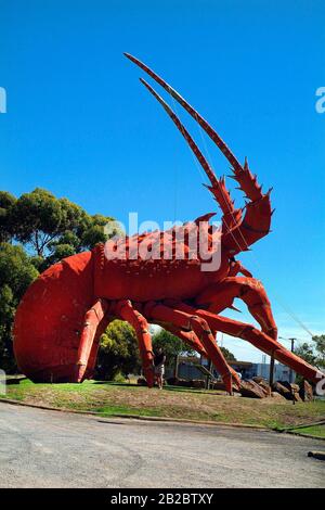 Kingston SE, Australia - January 26, 2008: Woman and sculpture of The Big Lobster - landmark and sign for a restaurant in Kingston SE Stock Photo