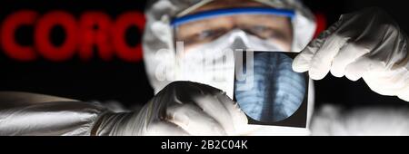 Male doctor wearing protective suit mask and gloves Stock Photo