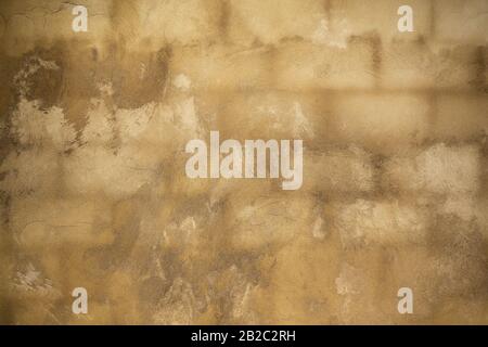 Wall made of bricks, covered with a fresh, wet plaster. Stock Photo