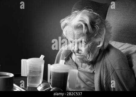 Black and white image of an old lady suffering from dementia - John Gollop Stock Photo