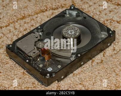 detail of opened broken hard drive, tech Stock Photo