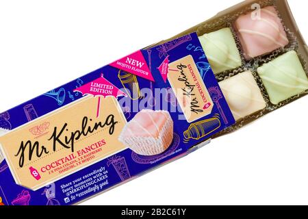 Box of Mr Kipling Cocktail Fancies opened to show contents set on white background - pina colada, raspberry daiquiri and mojito flavours Stock Photo