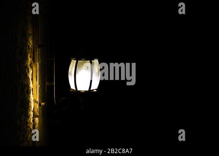 Street vintage lamp on a black background at night. Stock Photo