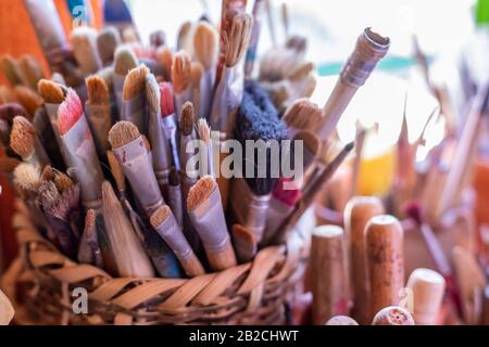 Yanhuitlan, Oaxaca, Mexico - Paint brushes the the studio of Manuel Reyes. Reyes is a noted ceramic artist, sculptor, and painter. Stock Photo