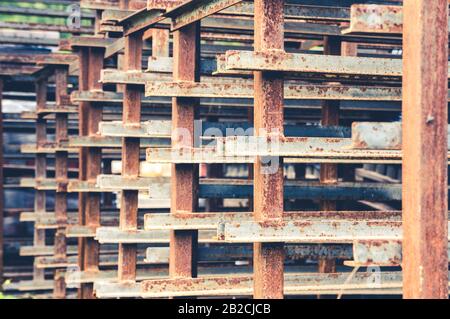 Abstract pattern of corroded metal angled bars forming lines Stock Photo